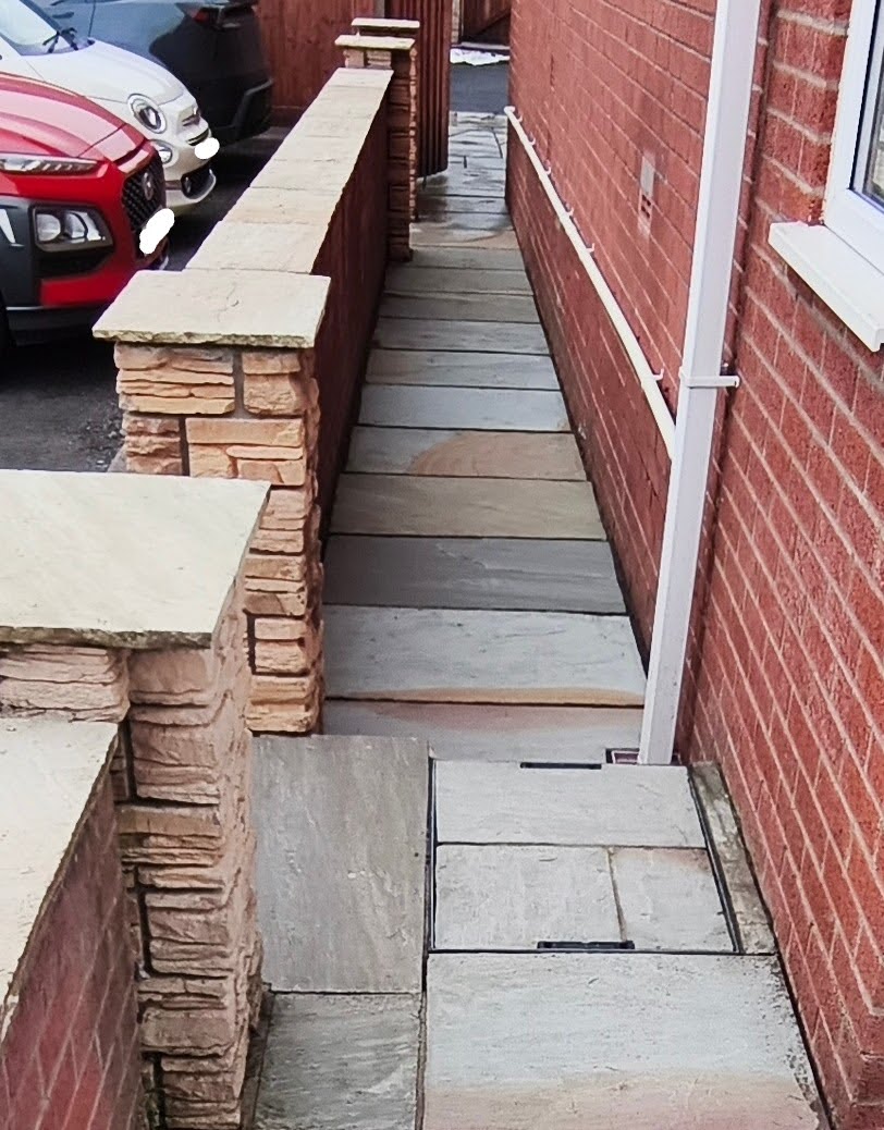 After sidepath cleaning: restored paving with cleaner surface and improved appearance